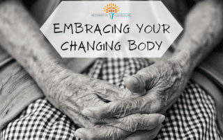 Wrinkled hands clasped in women's lap. end id.
