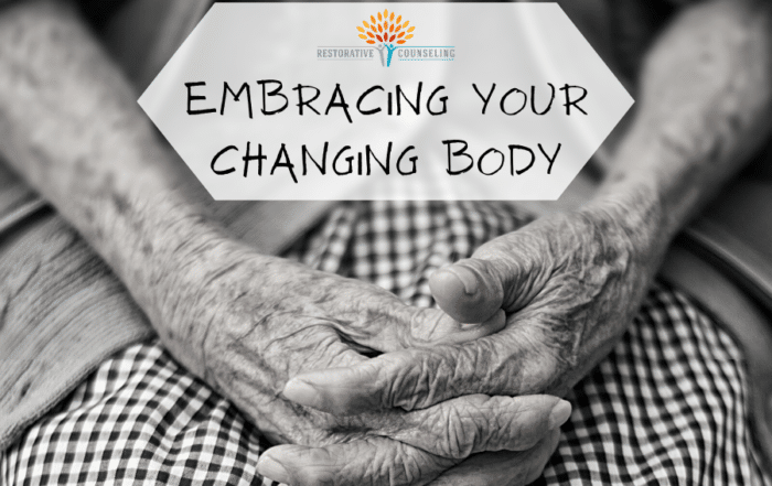 Wrinkled hands clasped in women's lap. end id.